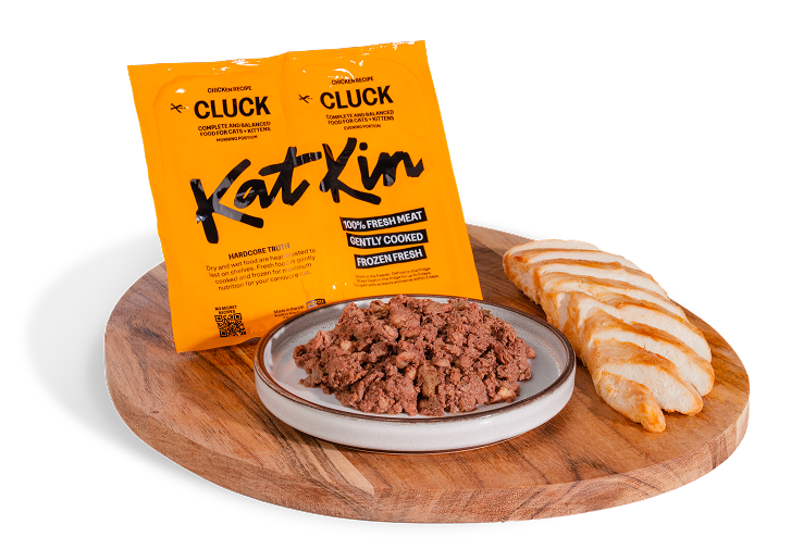 KatKin Cluck recipe on wooden board